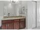 Bathroom boasts granite counters, dual sinks, and modern fixtures, offering style and functionality at 13598 Via Varra # 105, Broomfield, CO 80020