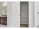 Hallway closet reveals a bathroom vanity and the door to another walk-in closet at 13598 Via Varra # 105, Broomfield, CO 80020