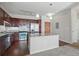 Open kitchen showcasing a large island with granite countertop, stainless steel appliances, and wood cabinetry at 13598 Via Varra # 105, Broomfield, CO 80020