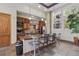 Community kitchen featuring a breakfast bar, stainless steel appliances, and ample counter space at 13598 Via Varra # 105, Broomfield, CO 80020