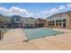 Outdoor pool with a safety cover and community building in the background on a sunny day at 13598 Via Varra # 105, Broomfield, CO 80020