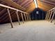 Unfinished attic with exposed beams ready for renovation at 2469 Ames St, Edgewater, CO 80214