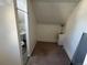 Attic space with a toilet and sink at 2469 Ames St, Edgewater, CO 80214