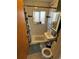 Compact bathroom featuring tiled shower, modern sink, and minimalist decor at 2469 Ames St, Edgewater, CO 80214