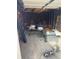 Empty garage with tools and outdoor furniture at 2469 Ames St, Edgewater, CO 80214