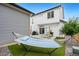 Relaxing backyard with a hammock, patio, grill, and low maintenance artificial turf at 10254 Worchester St, Commerce City, CO 80022