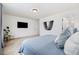 Cozy bedroom with soothing blue tones, plush bedding, and ample natural light at 10254 Worchester St, Commerce City, CO 80022
