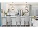 Elegant kitchen with a large island, white cabinets, and stainless steel appliances at 10254 Worchester St, Commerce City, CO 80022