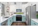 Stylish kitchen featuring white cabinets, modern appliances, and a bright, airy feel at 10254 Worchester St, Commerce City, CO 80022