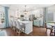 Beautiful kitchen with an island, modern lighting, and a seamless flow to the dining area at 10254 Worchester St, Commerce City, CO 80022