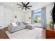 Comfortable living room with a sectional sofa, large window, and stylish decor at 10254 Worchester St, Commerce City, CO 80022