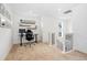 Versatile office space on upper level with a desk, shelving, and carpeted floor at 10254 Worchester St, Commerce City, CO 80022