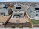 Aerial view of a home with a well-maintained yard, patio, and solar panels on the roof at 24432 E Tennessee Pl, Aurora, CO 80018