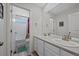 Bathroom featuring double sinks, a large mirror, and a separate shower and bathtub for added convenience at 24432 E Tennessee Pl, Aurora, CO 80018