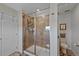 Well-lit bathroom features a glass-enclosed shower, a toilet and a vanity with ample space at 24432 E Tennessee Pl, Aurora, CO 80018