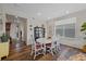 Charming dining area featuring a round table, white chairs, and an open layout at 24432 E Tennessee Pl, Aurora, CO 80018