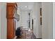 Elegant entryway with wood floors, a decorative console, and a view of the front door at 24432 E Tennessee Pl, Aurora, CO 80018