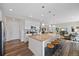 Spacious kitchen with stainless steel appliances, a large island with seating, and an open layout at 24432 E Tennessee Pl, Aurora, CO 80018