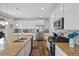 Gourmet kitchen featuring stainless steel appliances, granite counters, and white cabinets at 24432 E Tennessee Pl, Aurora, CO 80018
