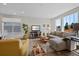 Bright living room featuring neutral tones, hardwood floors, and large windows offering abundant natural light at 24432 E Tennessee Pl, Aurora, CO 80018