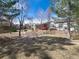 Spacious backyard with lawn and community green space at 6 Woodland Cir, Highlands Ranch, CO 80126