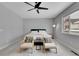 Bedroom featuring a bed, ceiling fan, area rug, and large window with an outside view at 6211 W 28Th Ct, Wheat Ridge, CO 80214