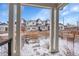 View from a porch looking towards townhomes with different exterior colors and wooden fences at 6211 W 28Th Ct, Wheat Ridge, CO 80214