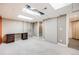 Spacious basement featuring carpeted flooring, desk area, and access to bathroom at 9674 Fox Den Dr, Littleton, CO 80125
