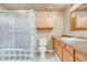 Neutral bathroom featuring glass shower enclosure and vanity with solid surface counter at 9674 Fox Den Dr, Littleton, CO 80125