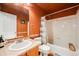 Well-maintained bathroom with white tiled shower and stylish vanity with sink at 9674 Fox Den Dr, Littleton, CO 80125