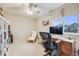 Inviting bedroom designed as office with natural light and comfortable seating at 9674 Fox Den Dr, Littleton, CO 80125