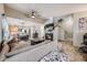Spacious living room with a fireplace, and open layout to the kitchen and dining area at 9674 Fox Den Dr, Littleton, CO 80125