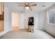 Well-lit room with ceiling fan and neutral walls, flexible for any purpose at 9674 Fox Den Dr, Littleton, CO 80125