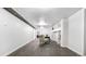 Open basement showcasing plank flooring, neutral walls, and accent chair seating at 555 Everett St, Lakewood, CO 80226