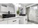 Stylish bathroom features double sinks with marble counters and a glass enclosed shower at 555 Everett St, Lakewood, CO 80226