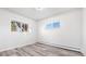 Bright bedroom with two windows and modern flooring offers a serene space at 555 Everett St, Lakewood, CO 80226