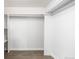Walk-in closet with white shelves, rods, and clean minimalist design at 555 Everett St, Lakewood, CO 80226