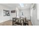 Bright dining area with sleek wood floors and views of the kitchen, perfect for everyday meals and entertaining at 555 Everett St, Lakewood, CO 80226