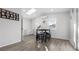 Bright dining area featuring skylight, modern light fixture, and views from the adjacent windows at 555 Everett St, Lakewood, CO 80226
