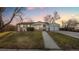 Inviting single story home with a detached garage and large front yard at 555 Everett St, Lakewood, CO 80226