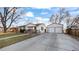 Cozy home with a detached two-car garage and a long driveway at 555 Everett St, Lakewood, CO 80226
