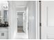 Bright hallway featuring an updated vanity and modern decor, creating a welcoming entrance into the home at 555 Everett St, Lakewood, CO 80226