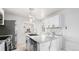 Bright kitchen with a modern island and stainless steel appliances at 555 Everett St, Lakewood, CO 80226