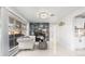 Bright living room with marble floors, fireplace, and modern lighting at 555 Everett St, Lakewood, CO 80226