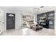Living room featuring marble tile floors, fireplace, and large windows at 555 Everett St, Lakewood, CO 80226