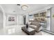 Bright living room showcasing a modern sofa and marble tile floors at 555 Everett St, Lakewood, CO 80226
