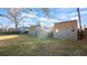Backyard features multiple sheds on a grass lawn providing ample outdoor storage and organization options at 555 Everett St, Lakewood, CO 80226