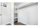 Bright walk-in closet includes a window, built in shelving, and closet rod for optimal organization and storage space at 555 Everett St, Lakewood, CO 80226