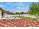 Fenced backyard featuring well maintained lawn, concrete patio and a fire pit at 5770 Waverley Ave, Firestone, CO 80504
