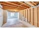 Unfinished basement featuring exposed ceiling and new construction wood framing at 5770 Waverley Ave, Firestone, CO 80504